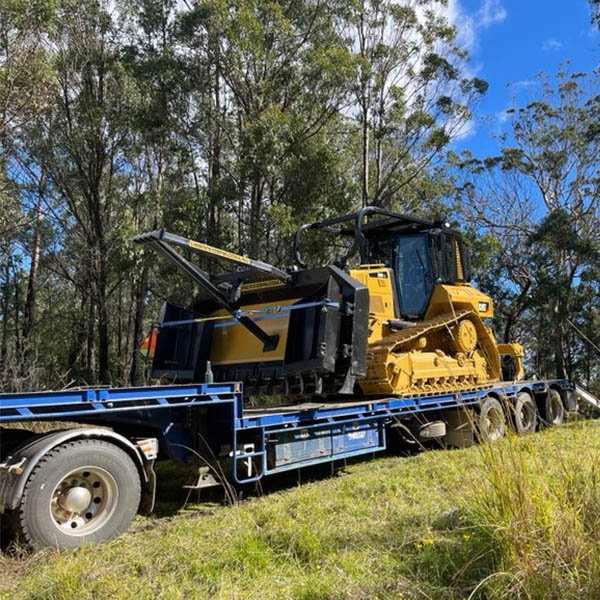Earthmoving equipment mounted on a truck in the Northern Rivers